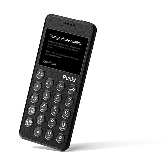 Black Punkt. MP02 phone standing on white background – Screen shows instructions for “Change phone number” with a continue option.