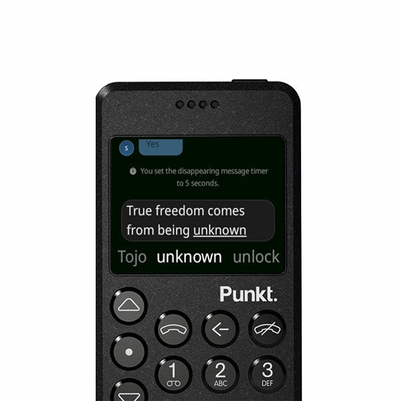 Black Punkt. MP02 phone with disappearing message – Screen displays text “True freedom comes from being unknown,” with a disappearing message timer notification.