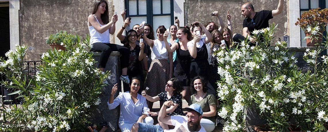 Group photo of participants in the 2017 Relational Design project, smiling outdoors. (same as 2)
