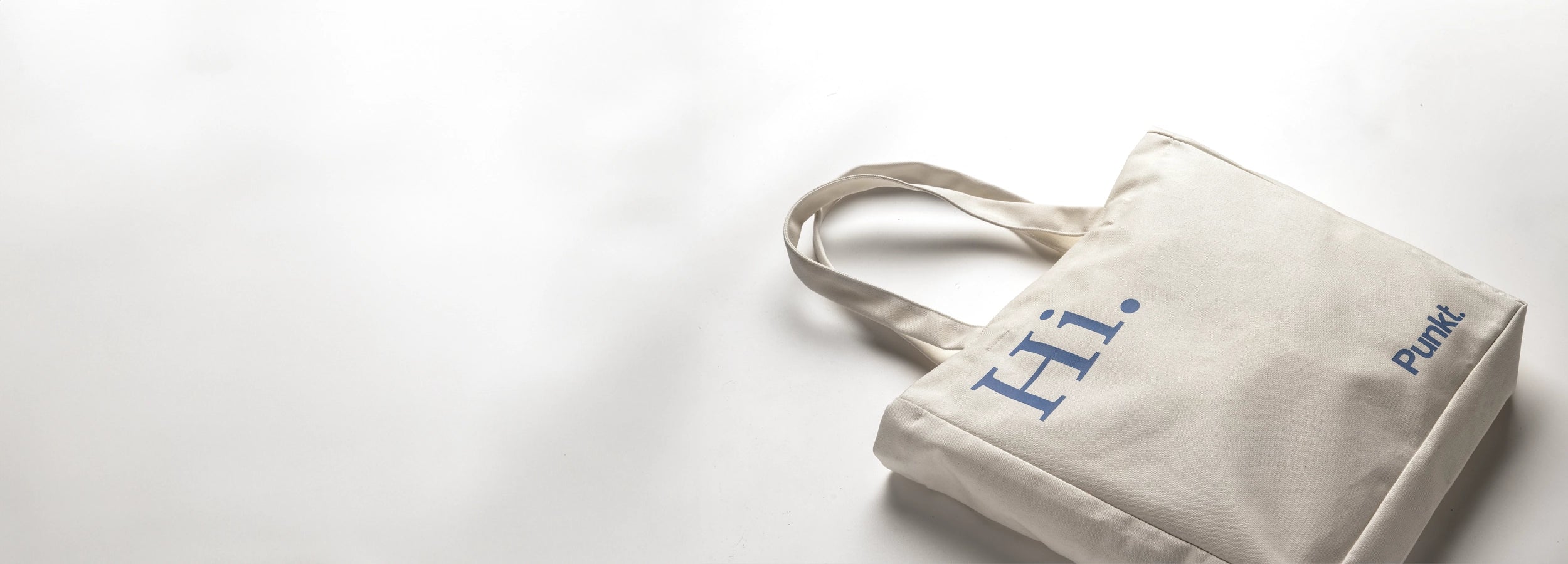 White tote bag with 'Hi' and 'Punk!' text on a white background