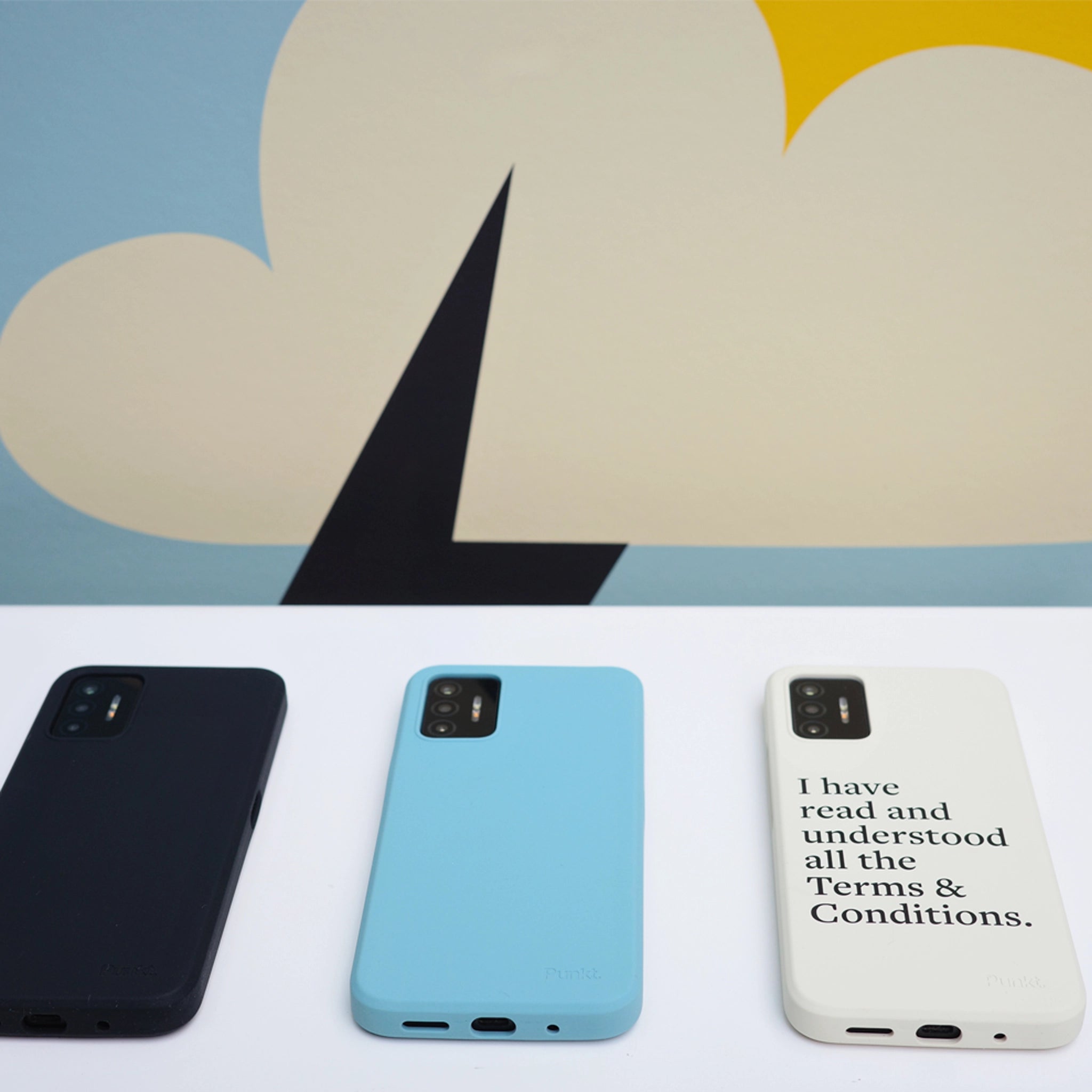 Punkt. MC02 protective cases in three colors – black, blue, and printed white – shown from the back on a white surface with abstract artwork behind.