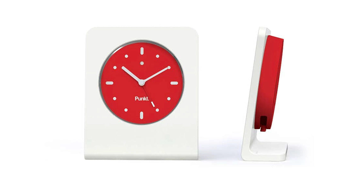 Side view of Punkt AC01 clock – White frame with red front, view from side showing the clock depth and profile.