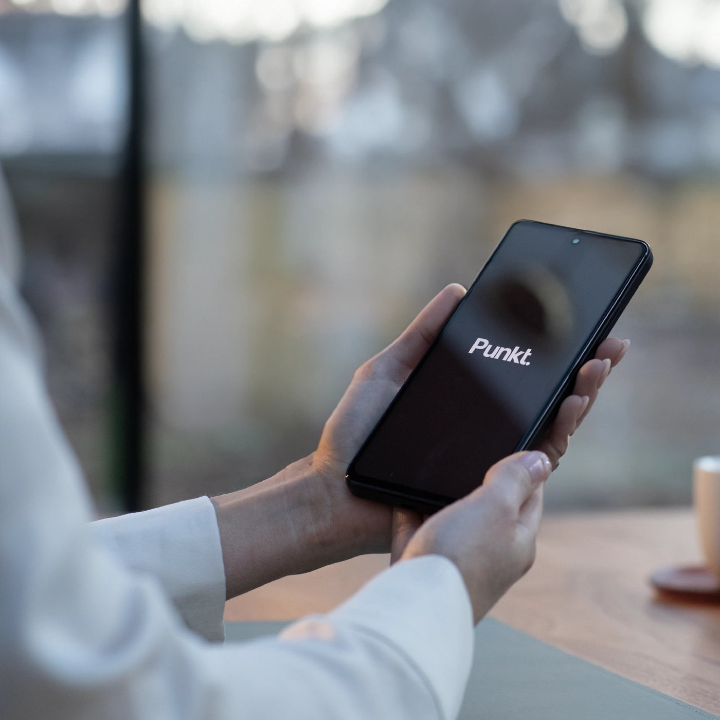 Close-up detail of the Punkt MP02 showing the data choice experience screen, icons aligned in a minimalist layout.