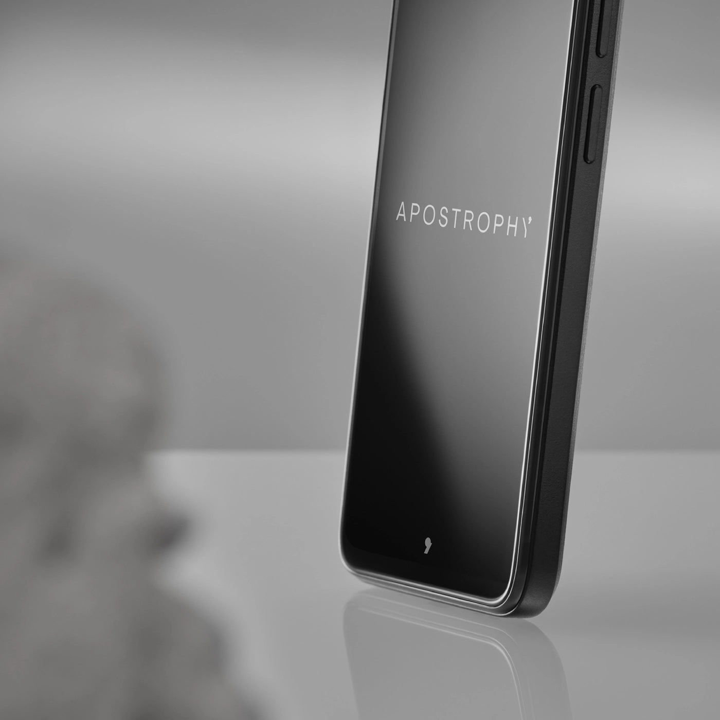 Black Punkt MC02 laid flat, front screen turned off, placed on a neutral background without borders.