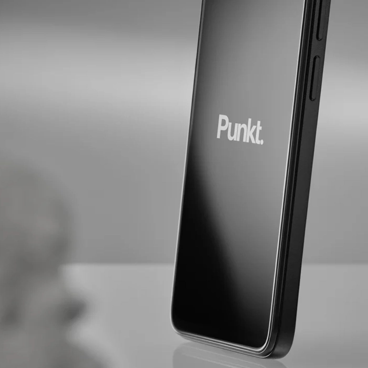 Punkt booth at CES 2024 featured in PCMag, showcasing minimalist phones and design-focused tech in a modern exhibition space.