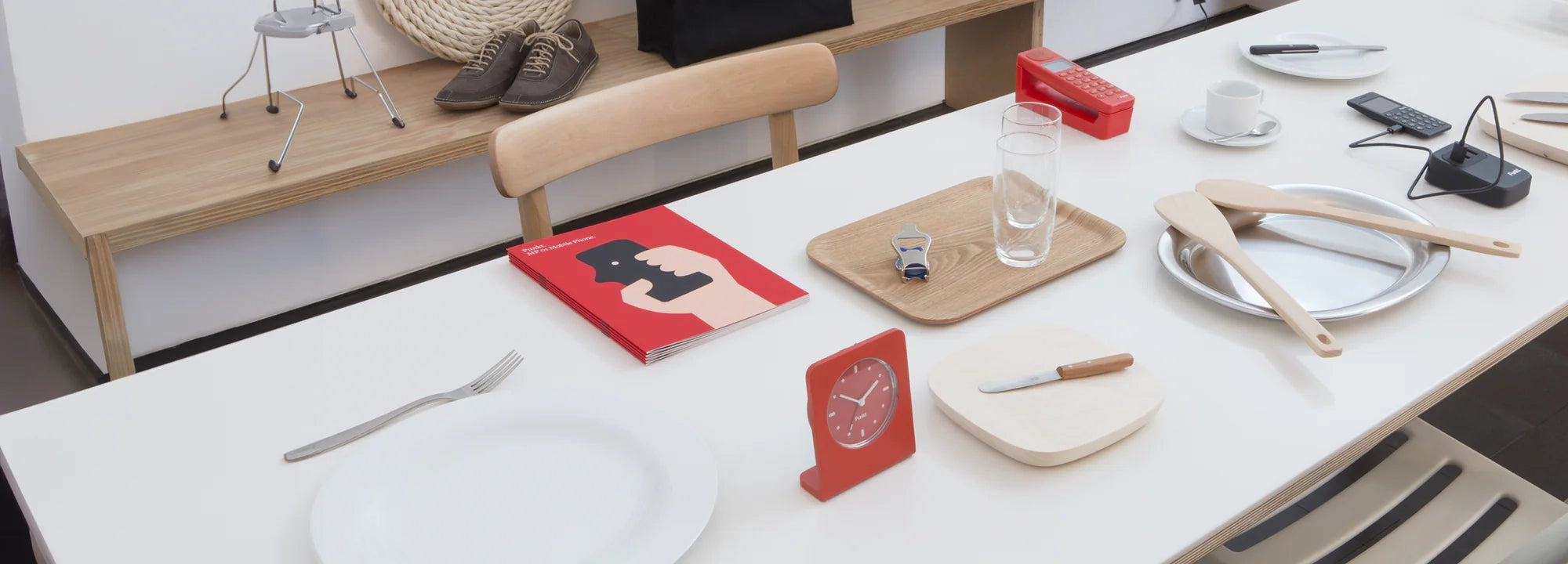 Punkt. product archive scene with AC02 alarm clock, DP01 phone, UC01 charger and MP02, set among modern home accessories.