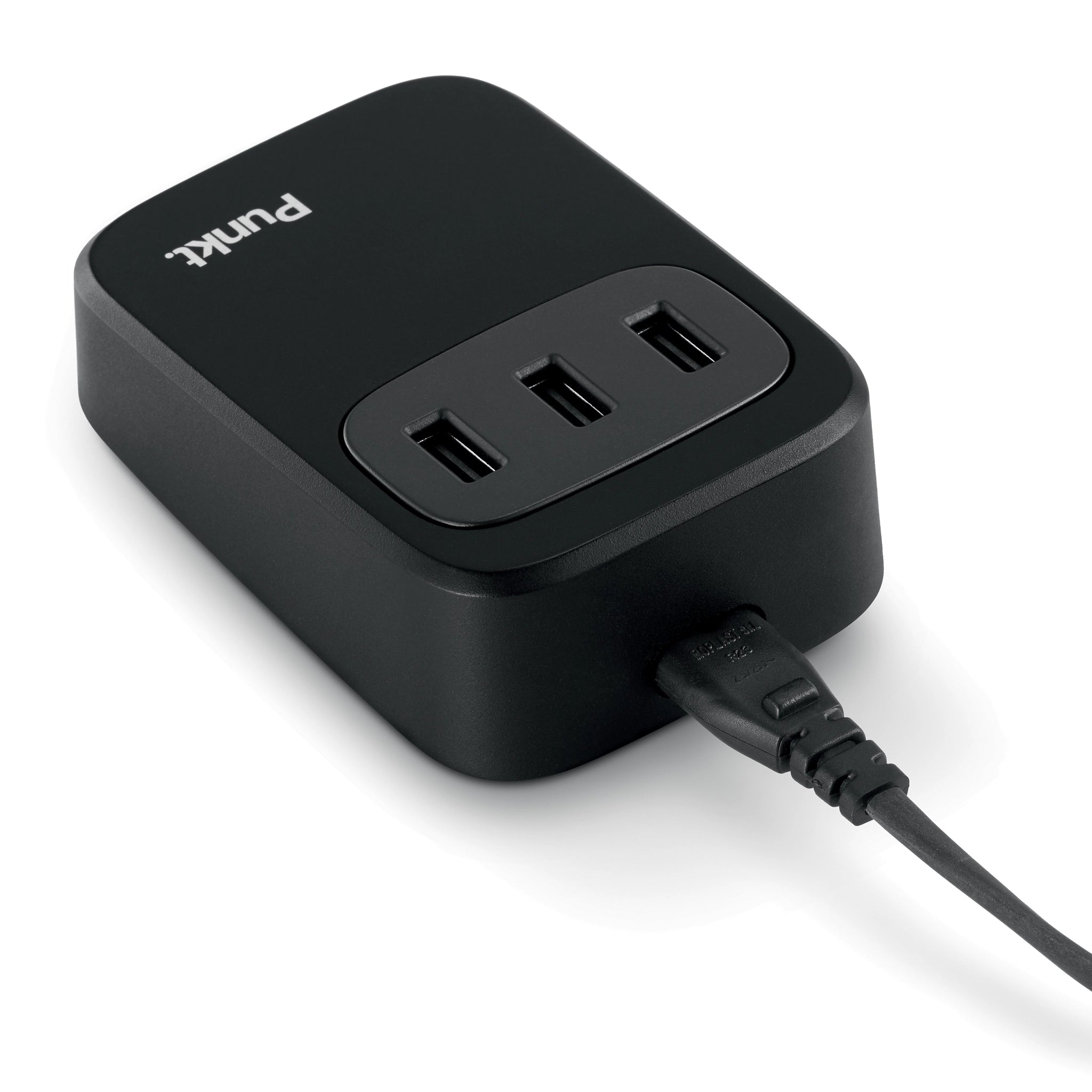 Back view of the Punkt UC01 USB charger showing three USB-A ports and power cable connected.