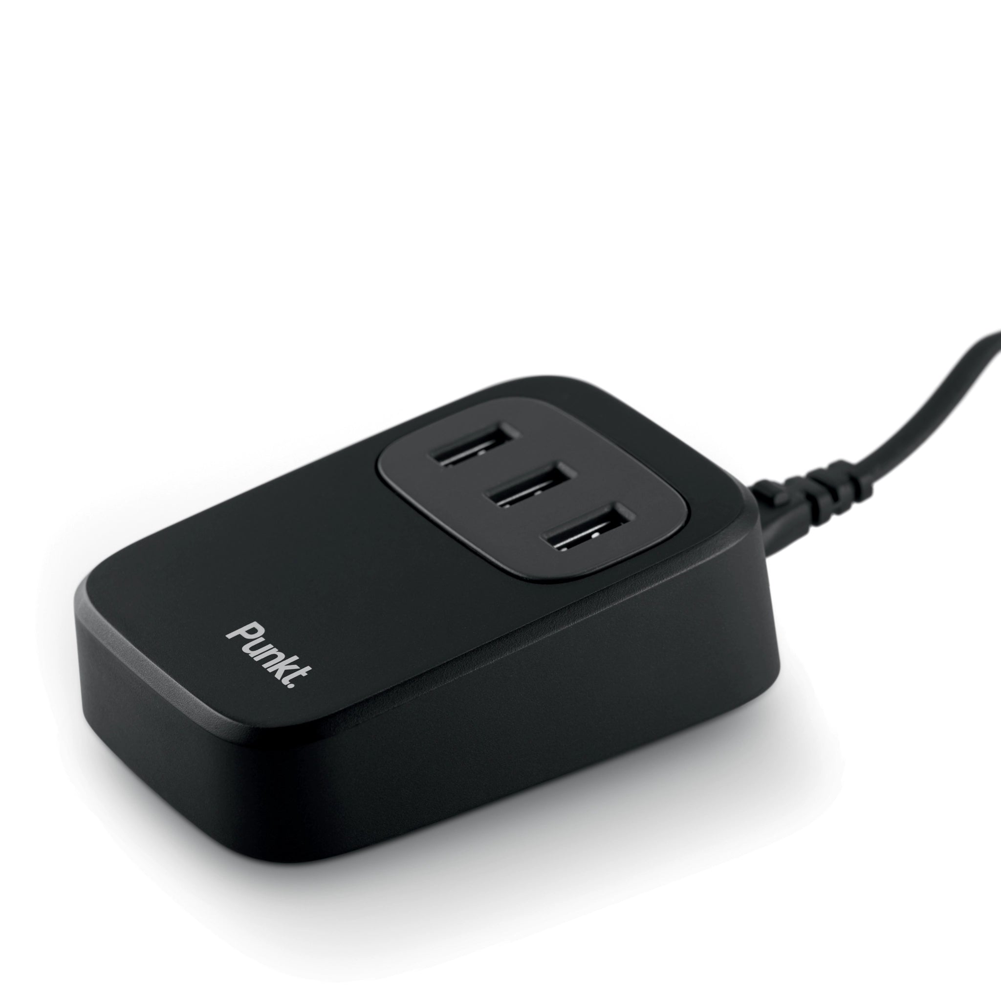Angled close-up of the Punkt UC01 minimalist USB charging station with three available ports.