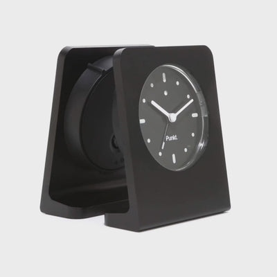 Side-by-side video showcasing the Punkt AC02 alarm clocks with black and blue second hands, highlighting their subtle design differences.