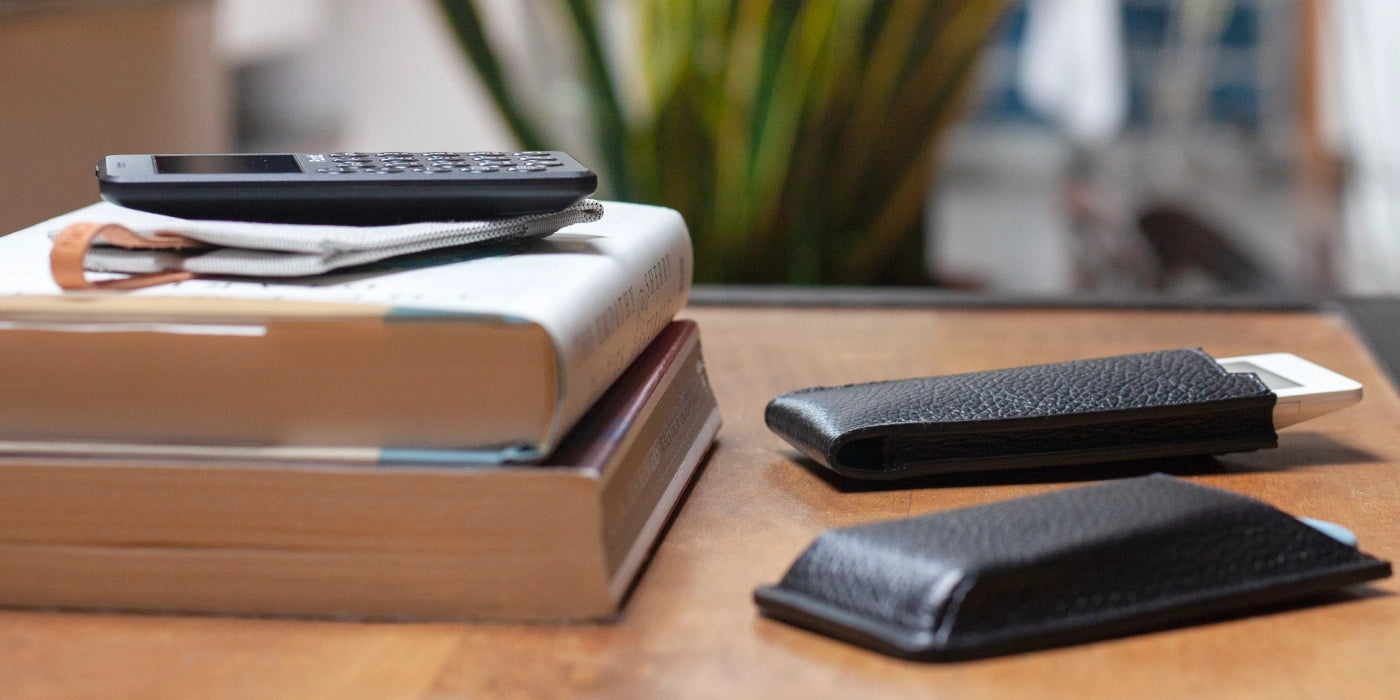 Black leather Punkt MP02 case by Danny P., featuring a minimalist design with fine stitching and secure phone fit.