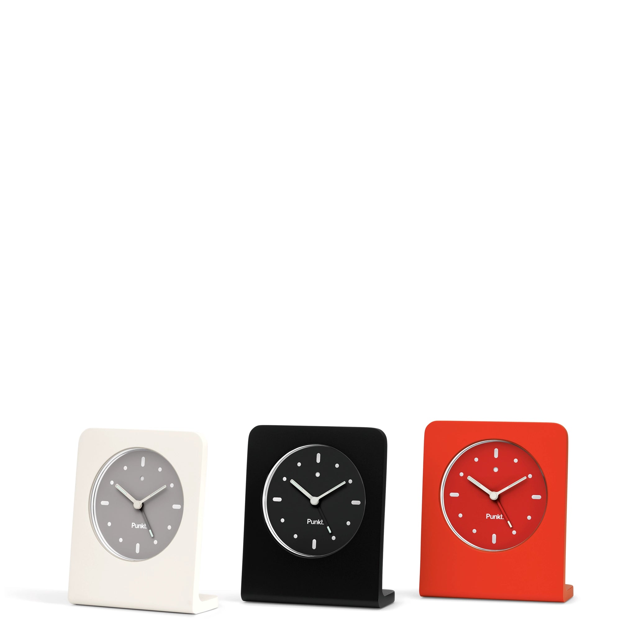 Punkt. AC01 analog alarm clocks in white, black, and red, minimalist design on white background.