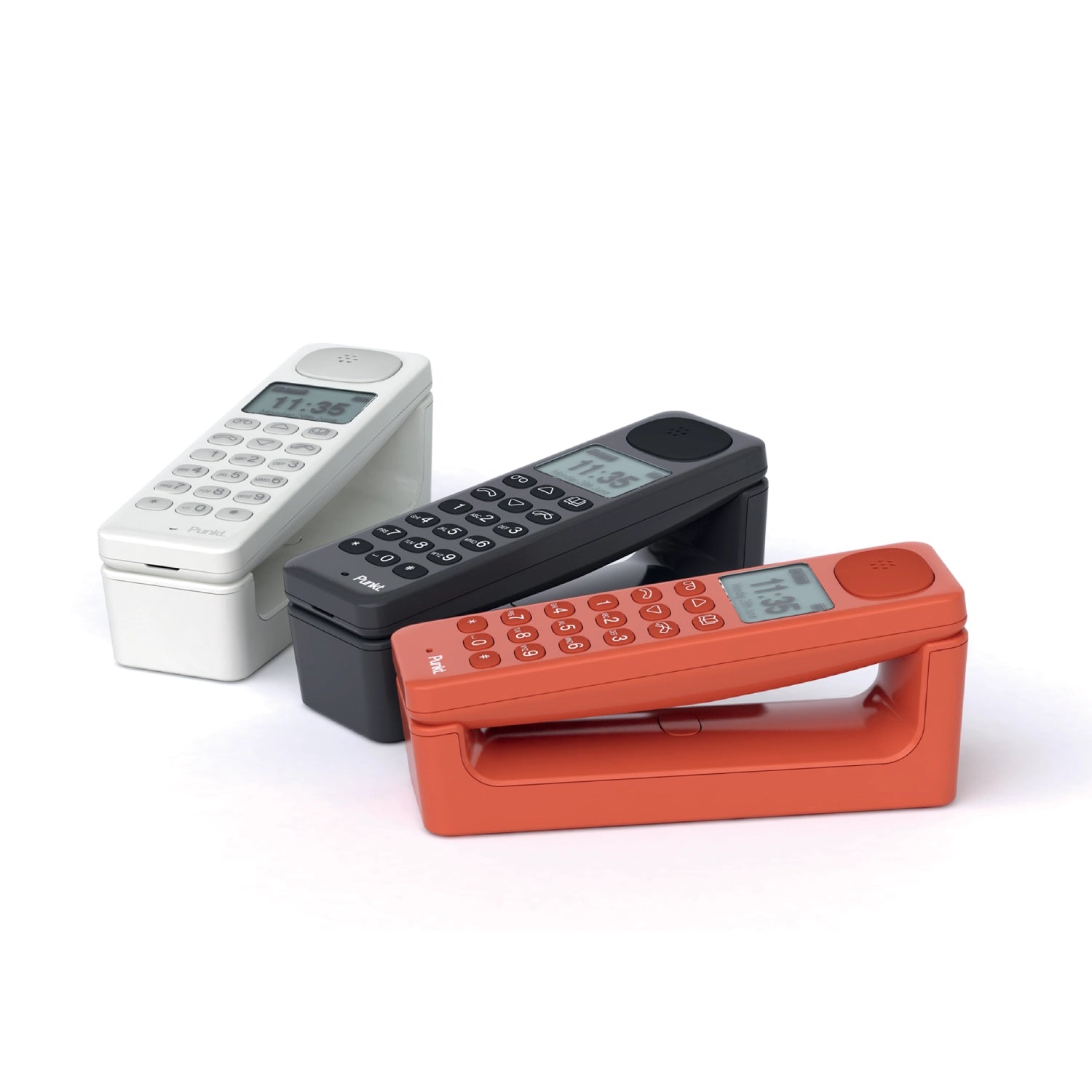 Punkt. DP01 cordless landline phones in white, black, and red, shown with matching base stations.