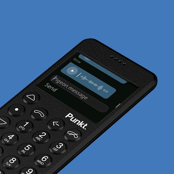 Angled black Punkt. MP02 phone on blue background – Screen shows a “Pigeon message” voice note with a playback bar and send option.