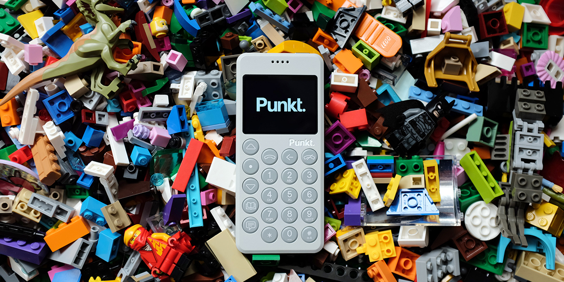 Punkt. MP02 light grey phone on lego toys 
