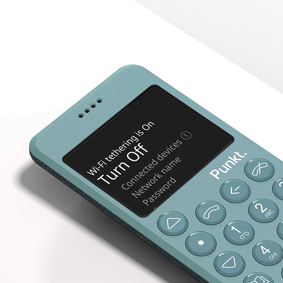 Minimalist Punkt. MP02 4G phone Light Blue color with Wi-Fi tethering feature displayed on screen, showcasing its compact design and physical keypad